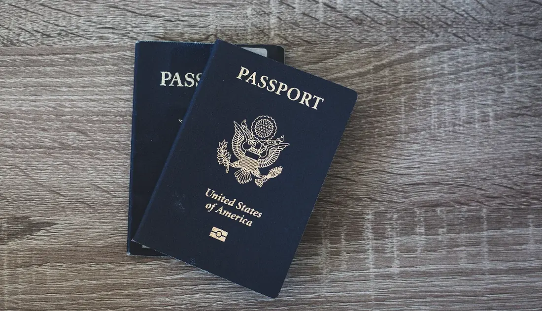 Passports and paperwork laid out for a move to Thailand